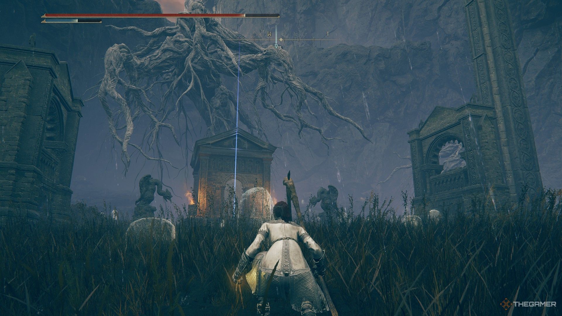 Player crouches and looks upon the Western Nameless Mausoleum marked by a beacon in Elden Ring: Shadow of the Erdtree.