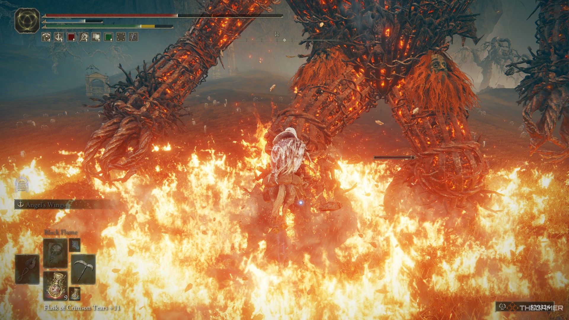 Player jumps over the flames of the Furnace Golem while on Torrent during battle in Elden Ring: Shadow of the Erdtree.